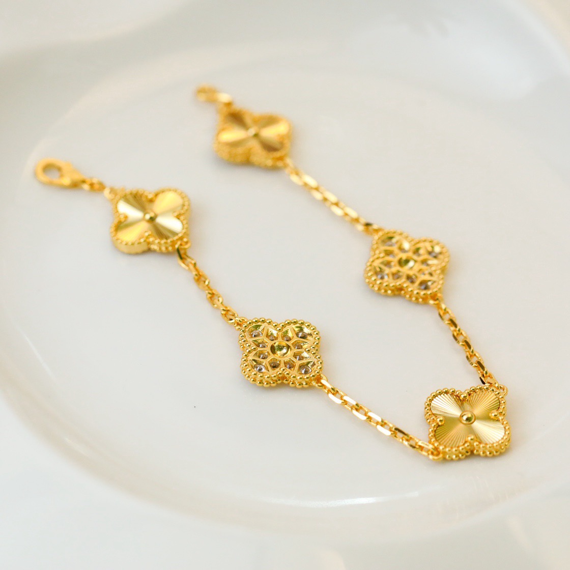 Van Cleef & Arpels classic engraved gold five-flower bracelet