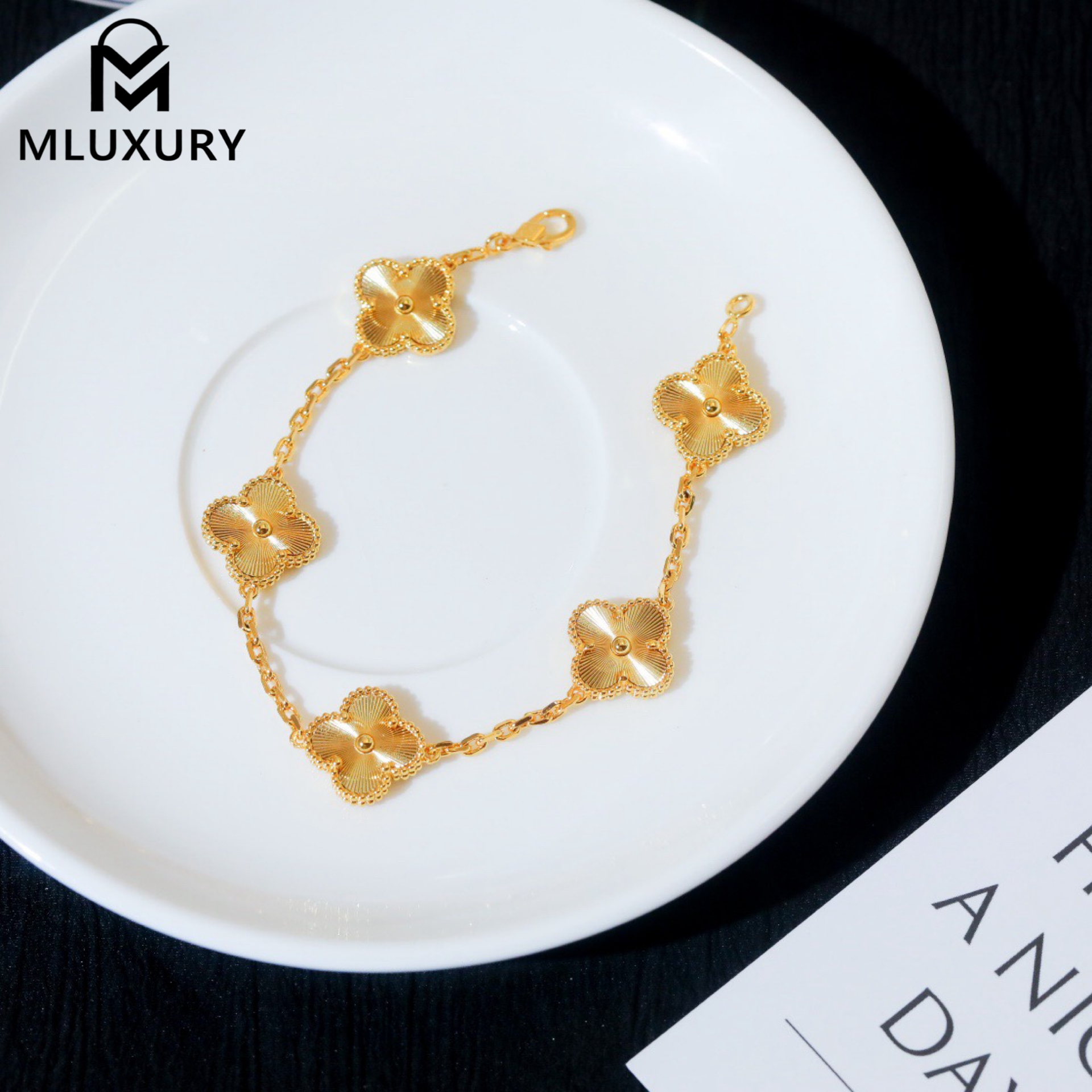 Van Cleef & Arpels classic engraved gold five-flower bracelet