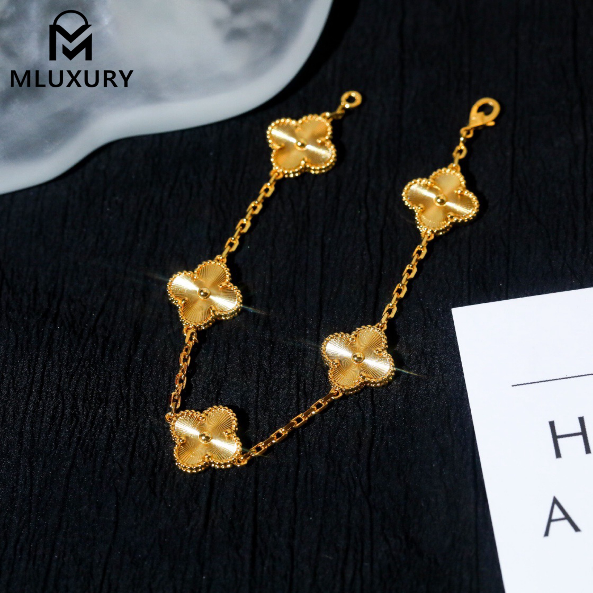 Van Cleef & Arpels classic engraved gold five-flower bracelet