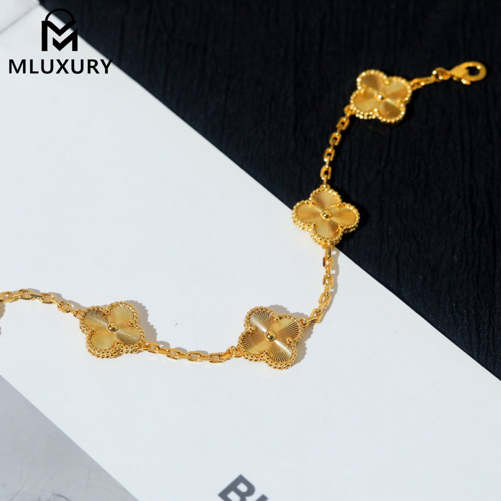 Van Cleef & Arpels classic engraved gold five-flower bracelet