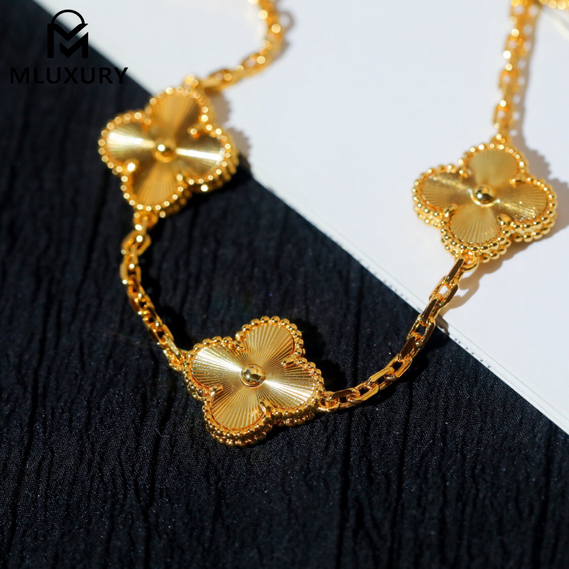 Van Cleef & Arpels classic engraved gold five-flower bracelet