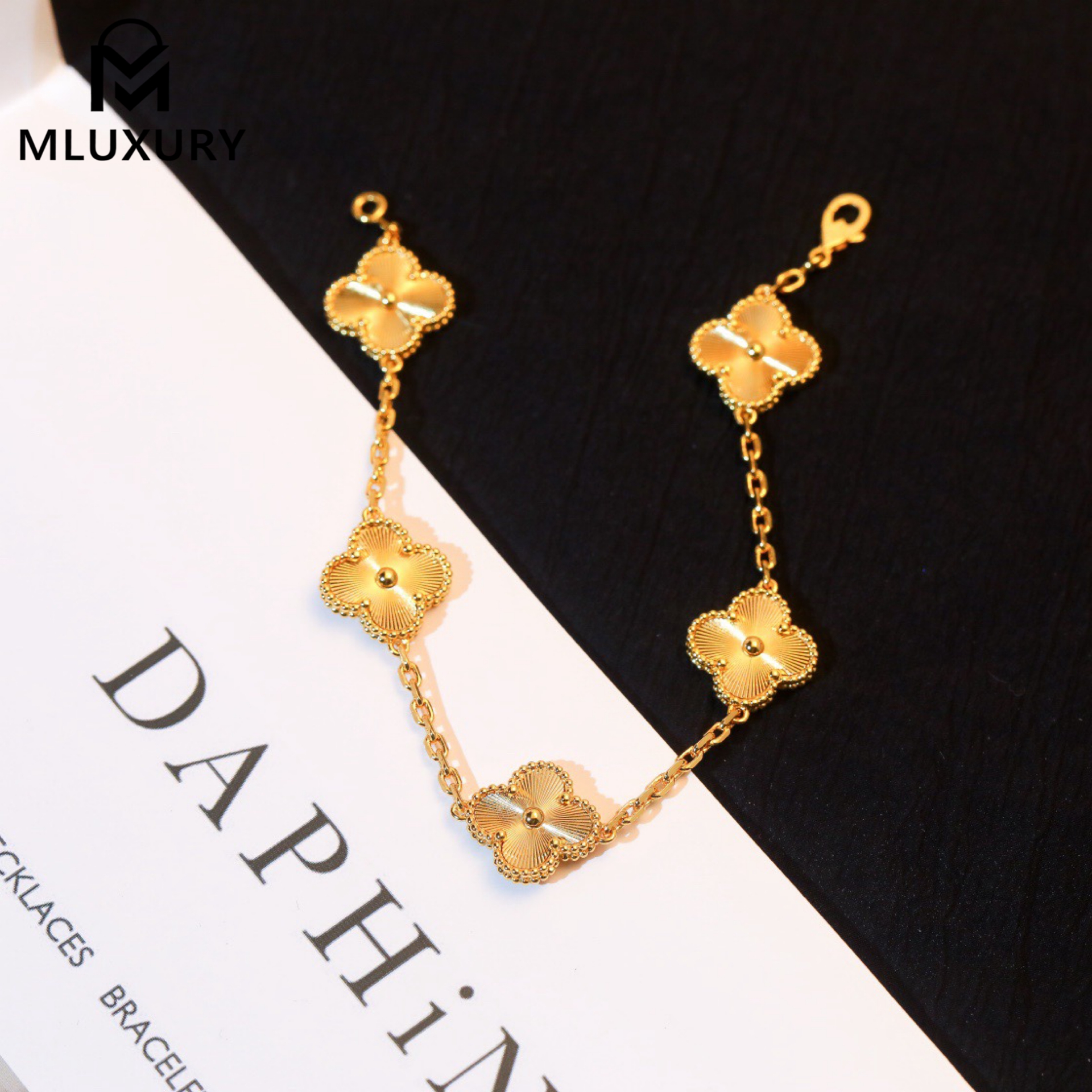 Van Cleef & Arpels classic engraved gold five-flower bracelet