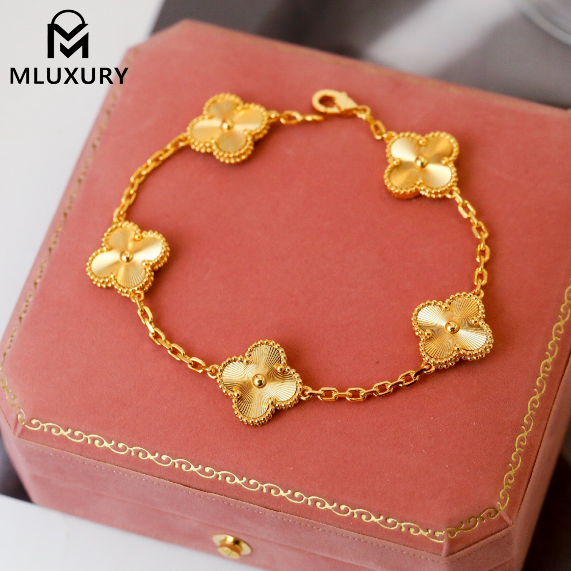 Van Cleef & Arpels classic engraved gold five-flower bracelet