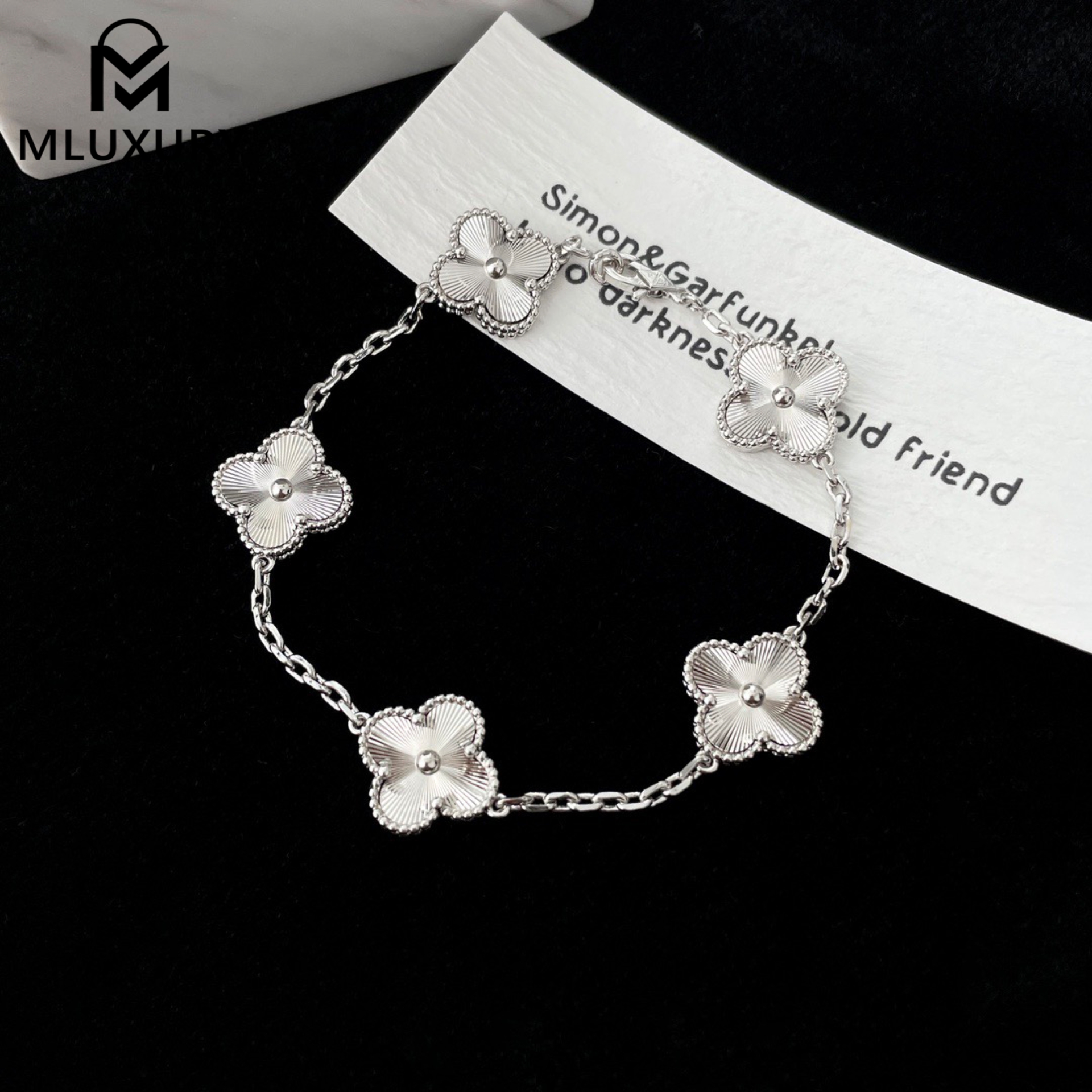 Van Cleef & Arpels white gold laser-cut floral bracelet