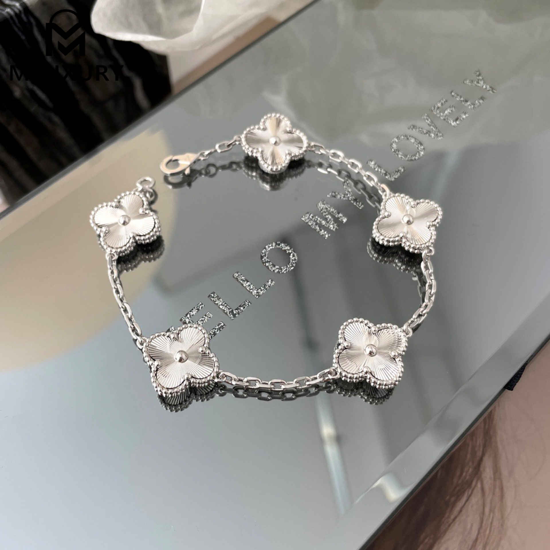 Van Cleef & Arpels white gold laser-cut floral bracelet