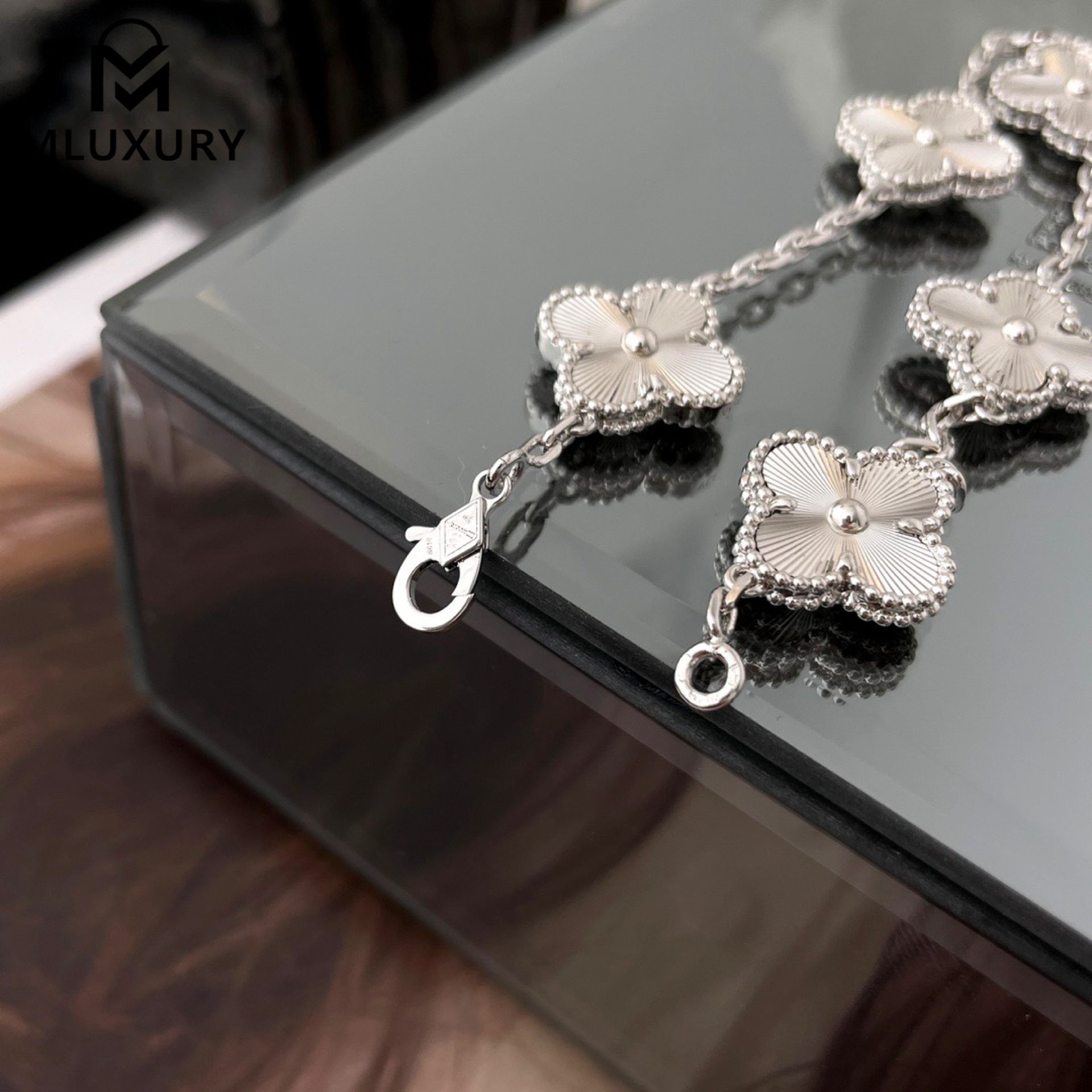 Van Cleef & Arpels white gold laser-cut floral bracelet