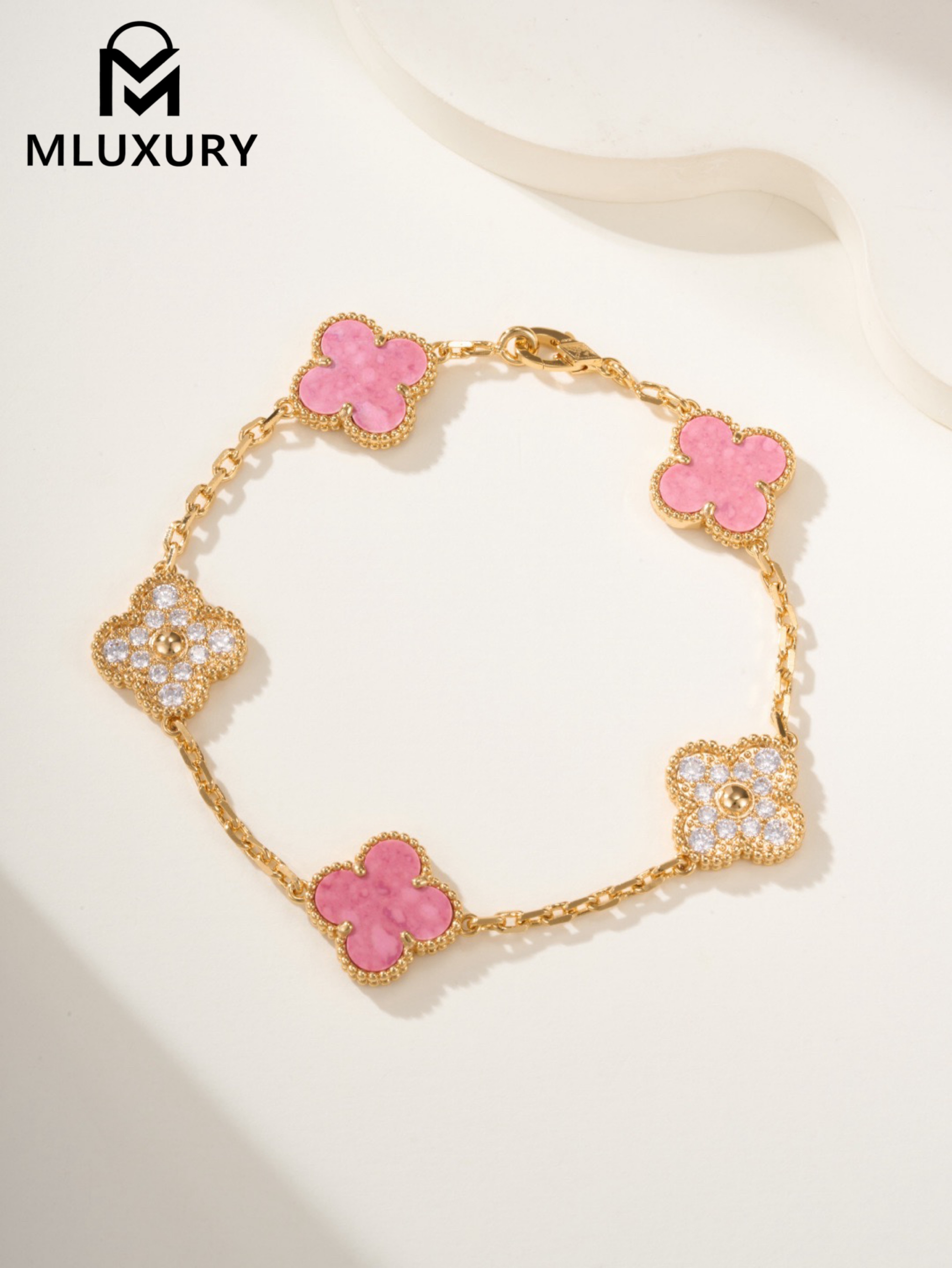 Van Cleef & Arpels interlocking diamond and rose quartz five-flower bracelet