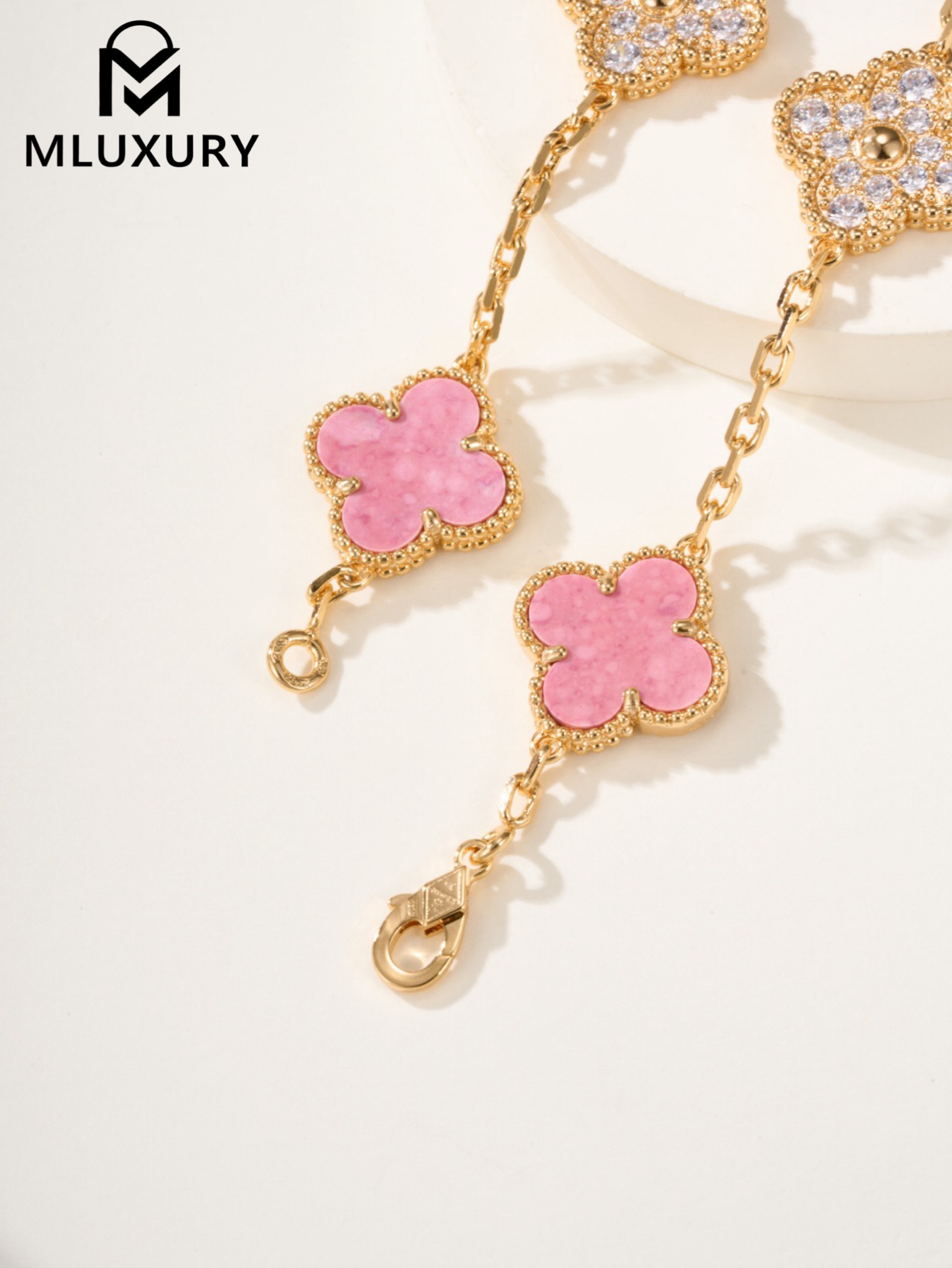 Van Cleef & Arpels interlocking diamond and rose quartz five-flower bracelet