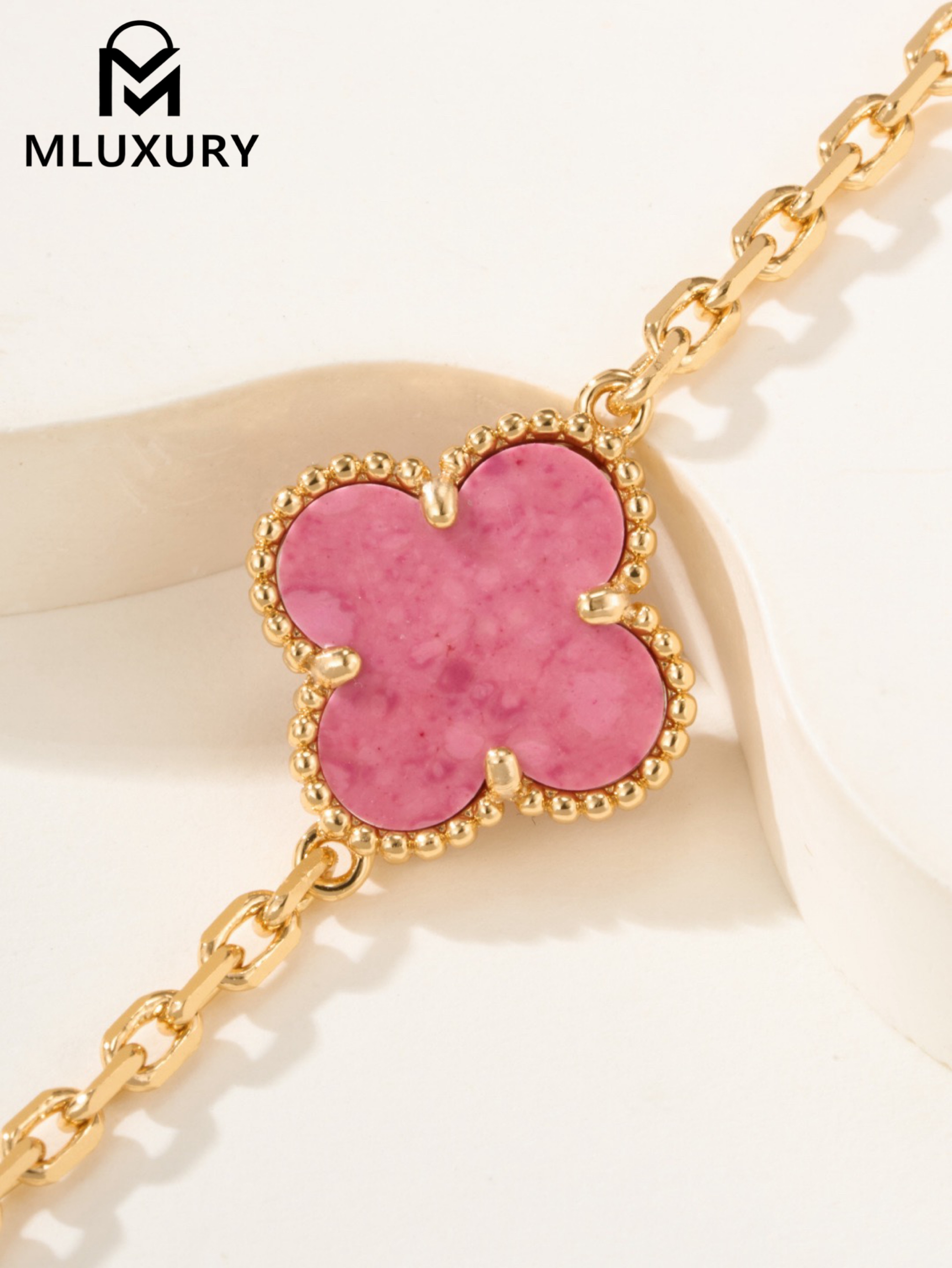 Van Cleef & Arpels interlocking diamond and rose quartz five-flower bracelet
