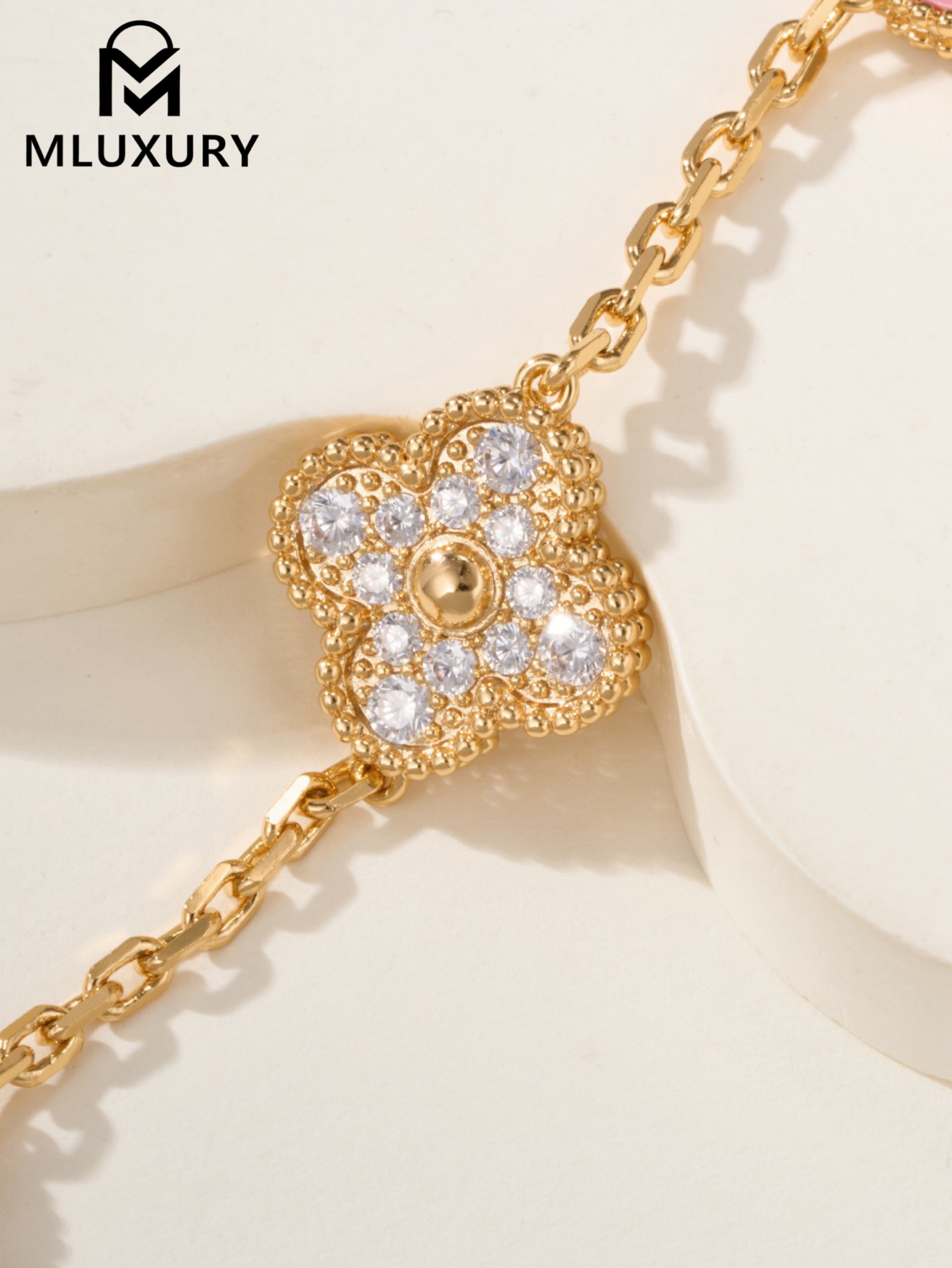 Van Cleef & Arpels interlocking diamond and rose quartz five-flower bracelet