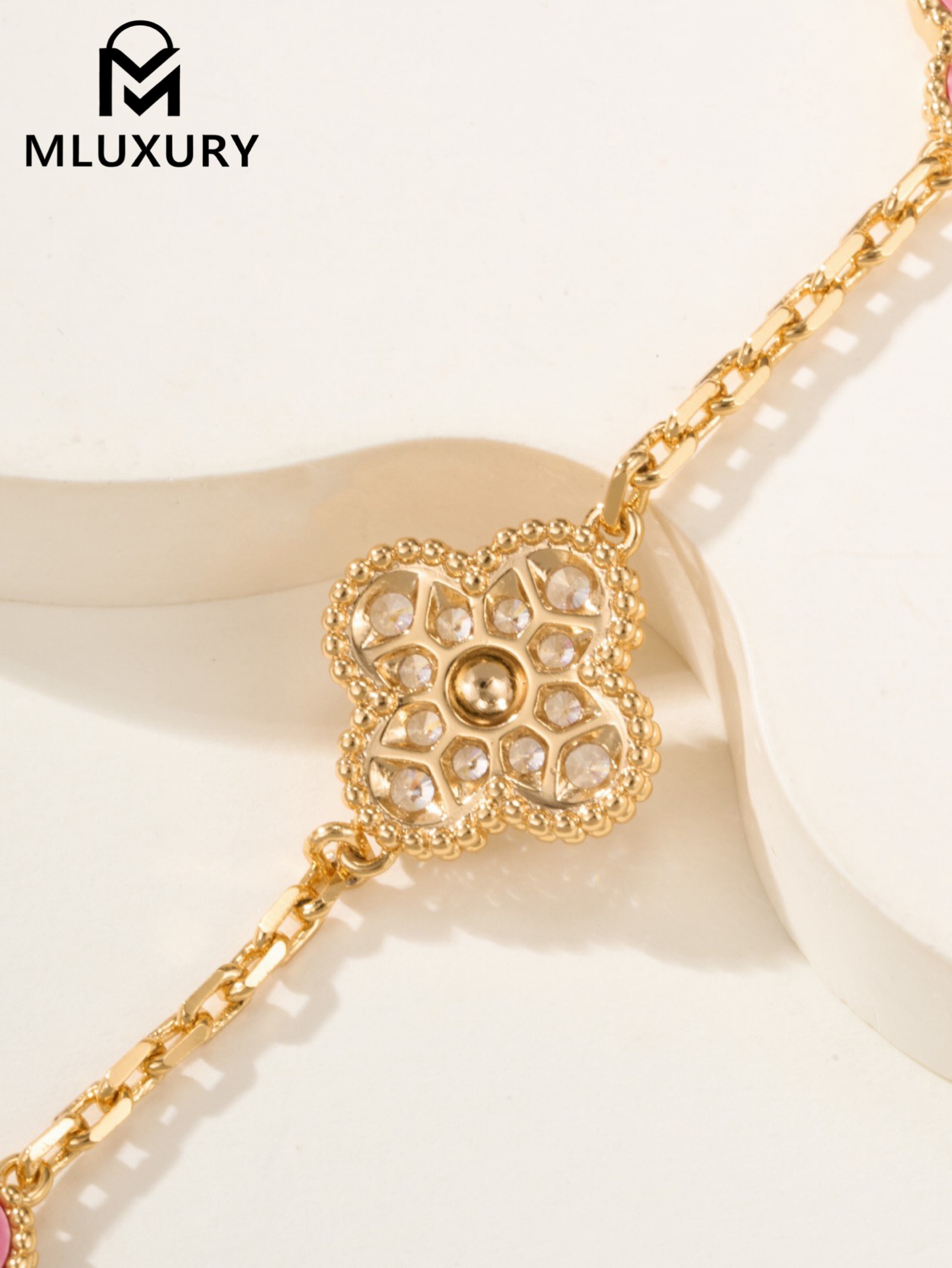 Van Cleef & Arpels interlocking diamond and rose quartz five-flower bracelet