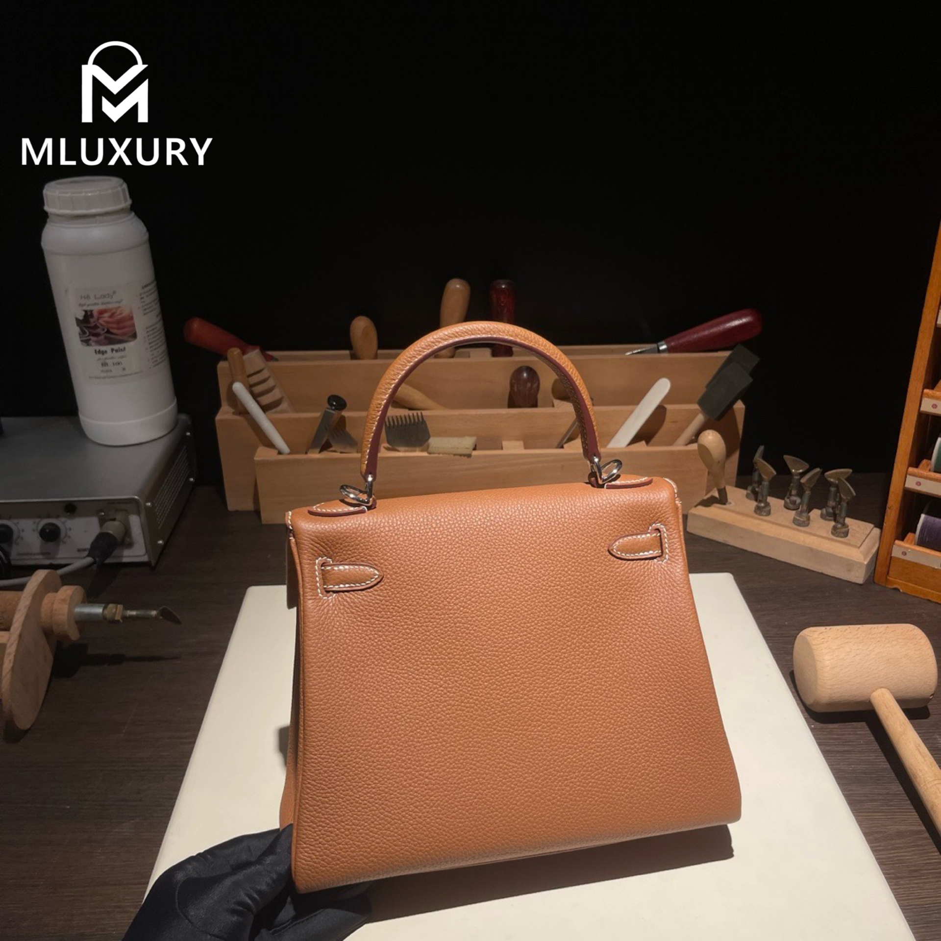 Hermès Kelly 25 Togo leather with inner stitching, Gold-brown, Silver hardware
