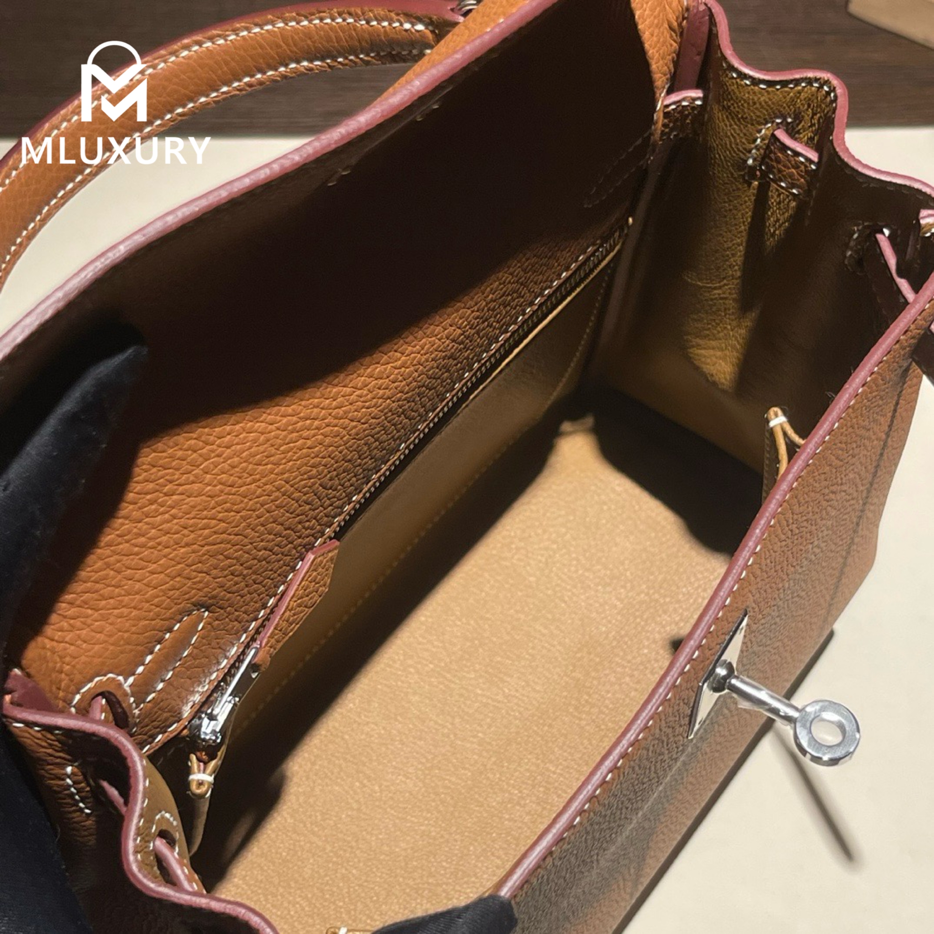 Hermès Kelly 25 Togo leather with inner stitching, Gold-brown, Silver hardware