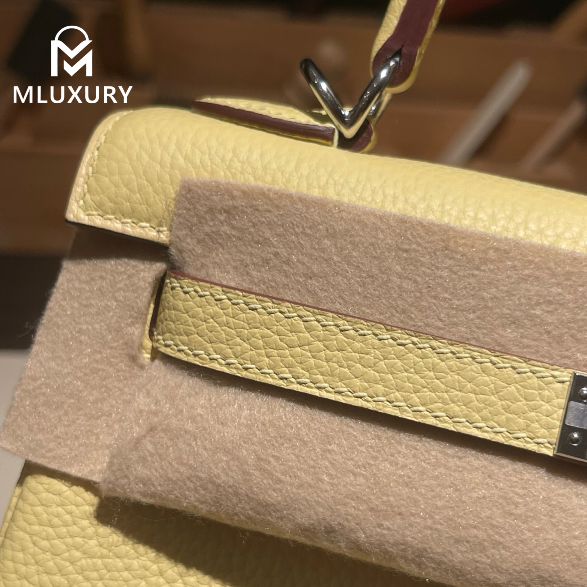 Hermès Kelly 25, Togo leather with inner stitching, Chick yellow color, Silver hardware